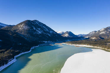 Deutschland, Bayern, Lenggries, Drone view of inflow of Sylvenstein Dam in winter - LHF00777