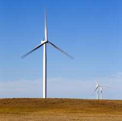 Wind Turbines in Colorado against blue sky - CAVF75606