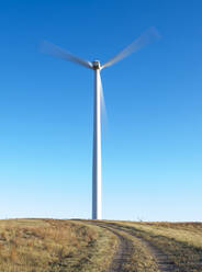 Wind Turbines in Colorado against blue sky - CAVF75610