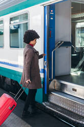 Tourist woman going for vacation trip on train - CAVF75680