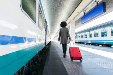 Tourist woman going for vacation trip on train - CAVF75695