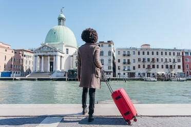 Tourist young woman going for vacation trip - CAVF75707