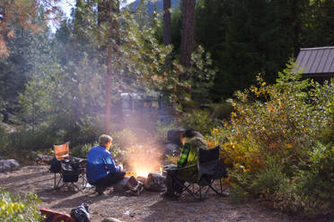 Sitting Around The Campfire In A Campground - CAVF75798