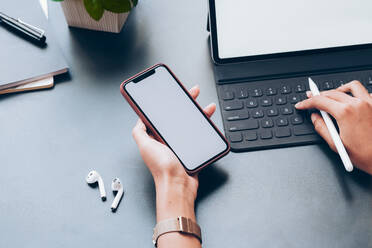 Close up of man hand holding smart phone. - CAVF75838