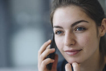 Portrait of young woman on the phone - KNSF07648