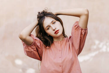 Portrait of teenage girl wearing pink blouse - TCEF00195