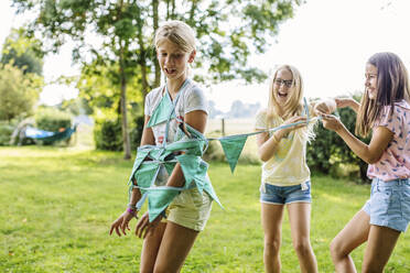 Happy girls having fun on a birthday party outdoors - SODF00623