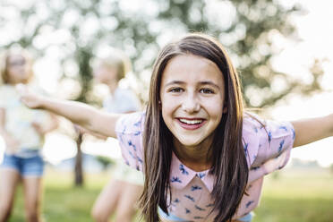 Portrait of happy girl on a birthday party outdoors - SODF00647