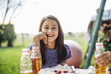 Portait of happy girl on a birthday party outdoors - SODF00672