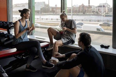 Group of young people having a break in gym - VPIF02076