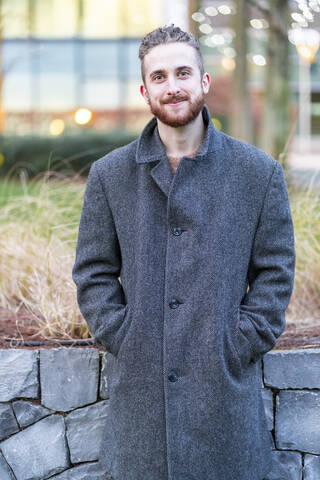 Portrait of smiling young man in the city stock photo