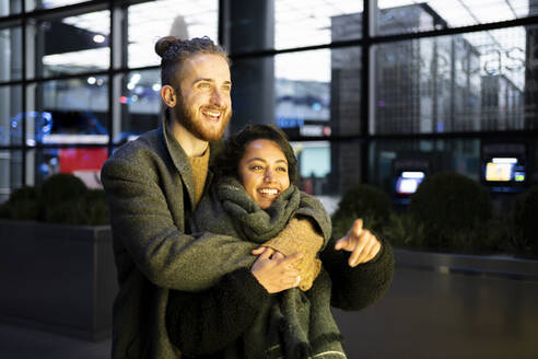 Happy young couple embracing in the city, London, UK - FBAF01321