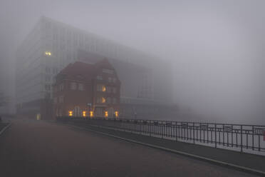 Germany, Hamburg, HafenCity quarter in thick fog - KEBF01505