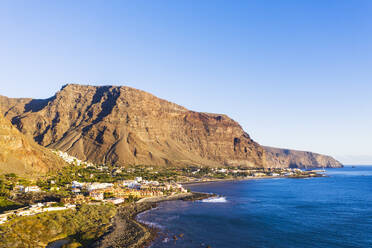 Spain, Santa Cruz de Tenerife, Valle Gran Rey, Clear sky over coastal town on La Gomera island - SIEF09589