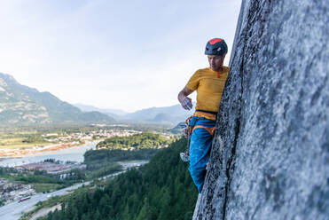 A climber traditional climbing on granite, Tantalus Wall, Squamish - ISF23909