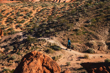 Female Hiker walking through the landscape - CAVF75985