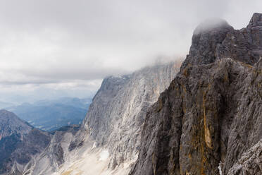 Alpine mountain views strewn with snow under a blue sky - CAVF76006