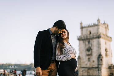 Affectionate expectant parents at the Torre de Belem, Lisbon, Portugal - DCRF00057