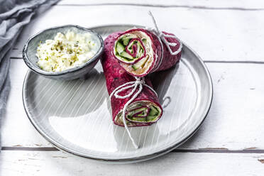 Beetroot wraps filled with ham, cheese, corn, iceberg lettuce, cucumbers and cream cheese - SARF04485