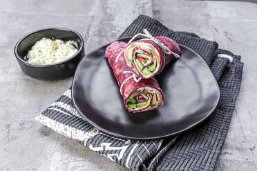 Beetroot wraps filled with ham, cheese, corn, iceberg lettuce, cucumbers and cream cheese - SARF04486