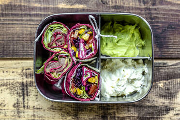 Lunch box containing beetroot wraps, cream cheese and guacamole - SARF04493
