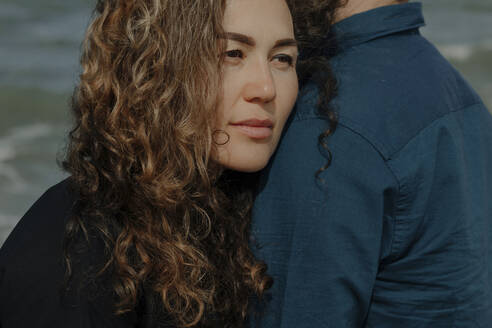 Portrait of woman leaning on her husband's shoulder - OGF00172