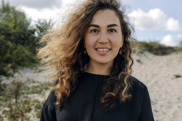 Portrait of smiling woman in the dunes, The Hague, Netherlands - OGF00182