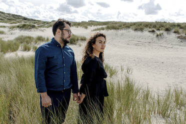 Couple walking in the dunes, The Hague, Netherlands - OGF00188