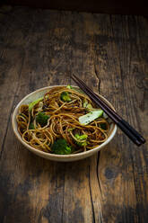 Bowl of Japanese soba noodles with bok choy, broccolies, soy sauce and black sesame - LVF08660