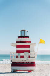 Red-white striped attendant's tower with yellow flag, Florida, USA - GEMF03477
