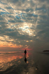 A boy walking on the beach - CAVF76145