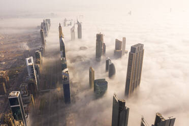 Aerial view of buildings surrounded by clouds Dubai, United Arab Emirates - AAEF06974