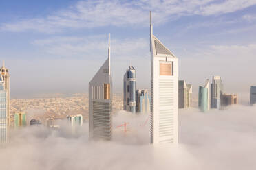 Aerial view of buildings surrounded by clouds Dubai, United Arab Emirates - AAEF06975