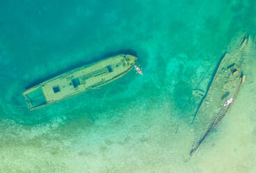 Aerial view of people using paddleboard above a sink boat in The Great Lakes, Tobermory, Ontario, Canada - AAEF07010