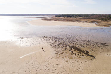 Aerial view of a man walking on sand, Hullo, Lääne County, Estonia - AAEF07073