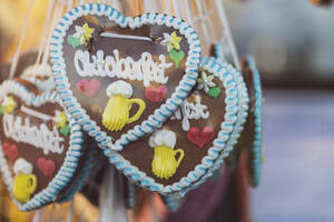 Germany, Bavaria, Munich, Heart-shaped gingerbread cookies made for Oktoberfest celebrations - MMAF01287