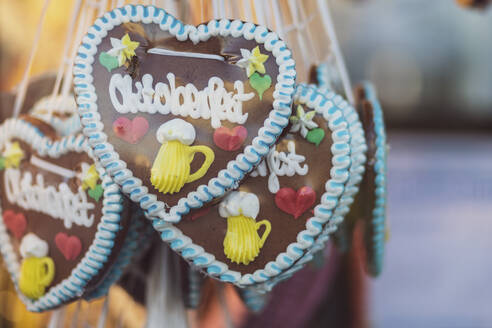 Germany, Bavaria, Munich, Heart-shaped gingerbread cookies made for Oktoberfest celebrations - MMAF01287