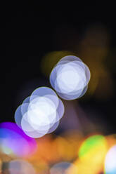 Germany, Colorful defocused lights at night - MMAF01298