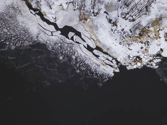 Russia, Saint Petersburg, Sestroretsk, Aerial view of icy shore of Gulf of Finland - KNTF04453