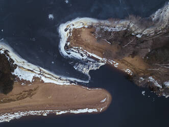 Russia, Saint Petersburg, Sestroretsk, Aerial view of frozen shore of Gulf of Finland in winter - KNTF04467