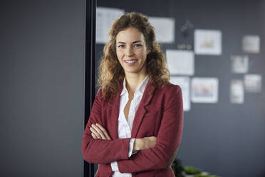 Portait of smiling businesswoman in office - RBF07071