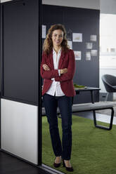 Portait of smiling businesswoman in office - RBF07073