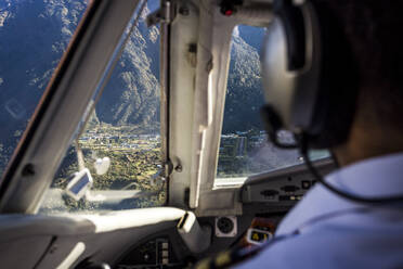Aeroplane cockpit flying in towards lukla airport in nepal - CAVF76389