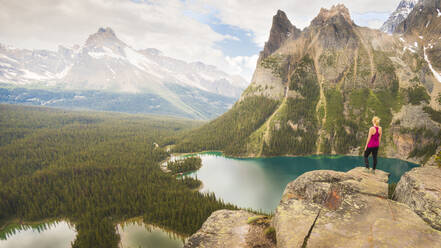 Female Hiker looking over Opabin Plateau in Yoho National Park - CAVF76526