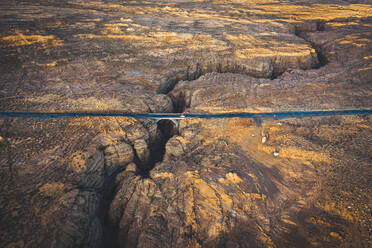 A slot canyon with a crossing road in Arizona - CAVF76824