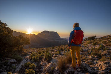 A woman hiking in the high country, El Divino mountain, Costa Blanca - CAVF77032