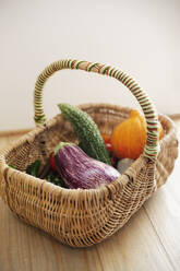 High angle close up of basket with fresh vegetables. - MINF14231