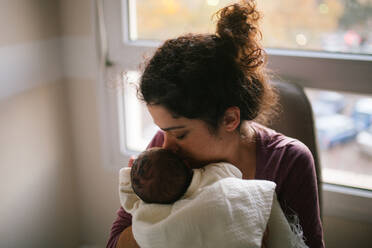 Mother Kissing Daughter At Home - EYF00133
