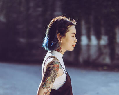 Profile View Of Woman With Tattoo On Shoulder - EYF00162