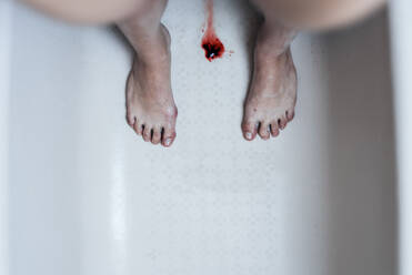 Directly Above Shot Of Blood Amidst Woman Standing In Bathtub - EYF00182